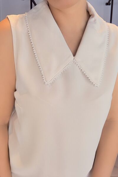 Krem Bebe Yaka İnci Detay Kolsuz Bluz